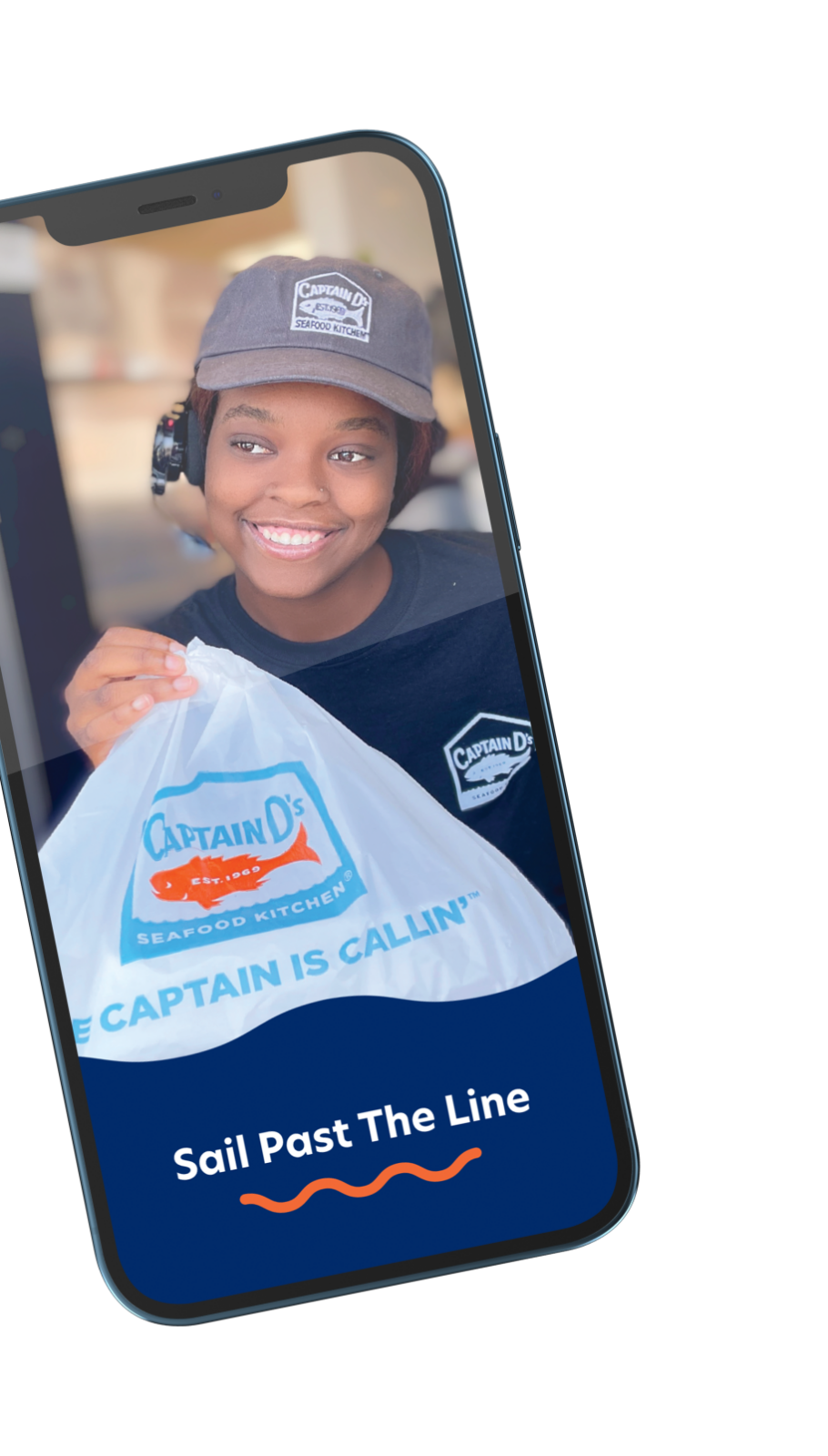 Phone showing the Captain D's app with an image of a drive thru worker handing a bag of food to a customer (offscreen).